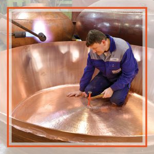 manufacturing a pot still (question: what's wrong here? Answer: no ear protectors!)