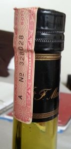 Tax stamp on a Martell bottle.