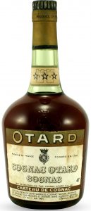 With a castle on the neck label; Otard on a green band