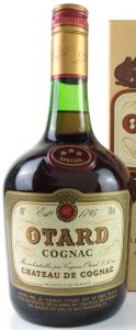 Brownish-green border around the label; cap in bronze and red (1990s)