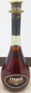 Neck capsule is straight; 70cl stated with Asian text on a brownish label with less clear letters; on the back-side also Asian text
