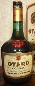 With a shoulder blob that says XXX Special; the label has a brown border; the emblem on the main label has two letters; 70cl (not stated); with import information printed at the bottom of the label