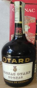 With a paper duty seal; 70 or 75cl; Otard in gold letters on a black surface; emblem on the label has no red; a castle in red on the neck label (1960s)