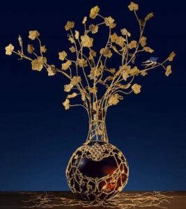 Les Remarquables, a dame jeanne designed by Laurentine Perilhou in 2023. Estimated worth: 1 million euro. Comes in a cabinet with glasses, a pipet and white gloves.