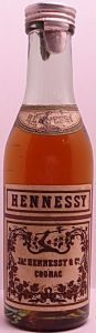 Hennessy on the neck label with an armed arm