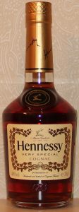 Slightly different: Jas Hennessy & Co in smaller letters; no black line on the top of the cap