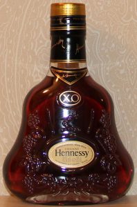 20cl XO; label brownish; Printed above the name is: 'Produce of France - Travel Retail'; the 'P' of product of France starts already above the first stem of the 'H' of Hennessy