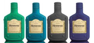 2013; label opening has a half crescent shape on top; emblem above the sleeve openeing and with eight round nubs; on the top it says: Hennessy, never stop, never settle