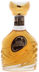 'Cognac' in large letters and right below 'cognac' is 'appellation' in small letters. The above curl starts above the 'C' of COGNAC.
