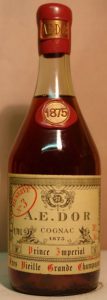 Red wax top with AEDOR on it; glass blob with 1875, year also written on the label