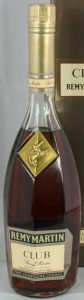 70cl; Remy Martin on a green background; two lines of text below 'Club de Remy Martin'