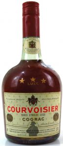 Trois etoiles luxe on the label; standard text underneath plus an address line; 0,70L (capital 'L') stated; also the cap is a little different