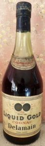 700ml liquid gold (vsop), with a neck label and no shoulder blob; date of estableshment stated and Address line below