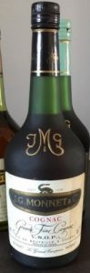 70cl grande fine cognac; salamander attached to the black part of the label, black capsule