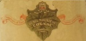 Suppliers of fine cognac since 1838 on a banner and with a grape leaf