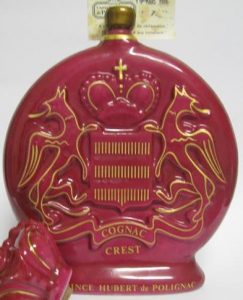 Crest in a red carafe de Limoges, neck is different (red between cork and golden ring); 1986