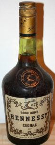 bras armé above Hennessy; 40% underneath cognac, different capsule (1960-1970s)
