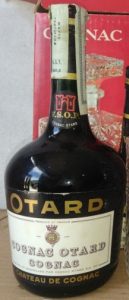 With a paper duty seal; 70 or 75cl; Otard in gold letters on a black surface; emblem on the label has no red; a castle in red on the neck label (1960s)