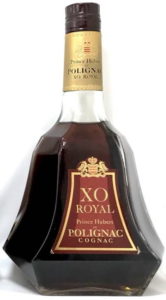 Content not stated; letters on neck capsule in black (70cl, seen standing next to another 70cl bottle)