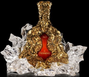 Celebrating 150 year XO; enveloped in a 24 carat gold-dipped-bronze crinkled sleeve and a encased by a fractured glass glorifier; 150 bottles made