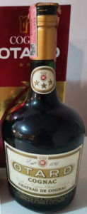 Otard on a gold coloured band in the middle of the label and additional text on both sides of the label: distillato di vino and contenuto (?idrato) 75cl; Italian import by Sacco (1960s)