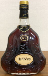 With Asian text on the neck; no alcohol percentage or content stated on the front; on the back: XO and Asian text, 700ml; 