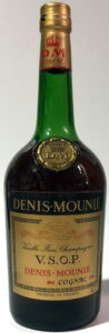 DM on the cap and DM on the shoulder blob; content not stated, copper coloured cap; 0,7L is stated on the bottom (1970s)