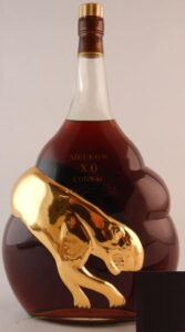 3L XO, red and gold capsule