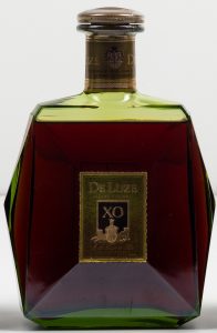 Label has different colour and is smaller; 70cl indicated on the neck
