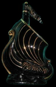 Black ship with gold stripes in the sail