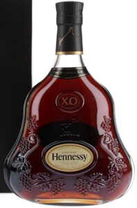 Background of label is lighter yellow and the letters of Hennessy are more dark. No duty seal on top, but English duty stamp on back side.