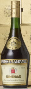 The label has adornments at the borders;; content not indicated; 40° and 70 proof indicated; brown shoulder label with the Royal appointment printed