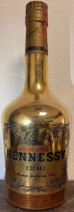 Gold bottle; '240' on the shoulder and 'aquavite di vino'; Italian import by Wax & Vitale (1960s)